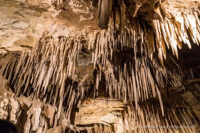 Interior view of a cave with stalactites and stalagmites