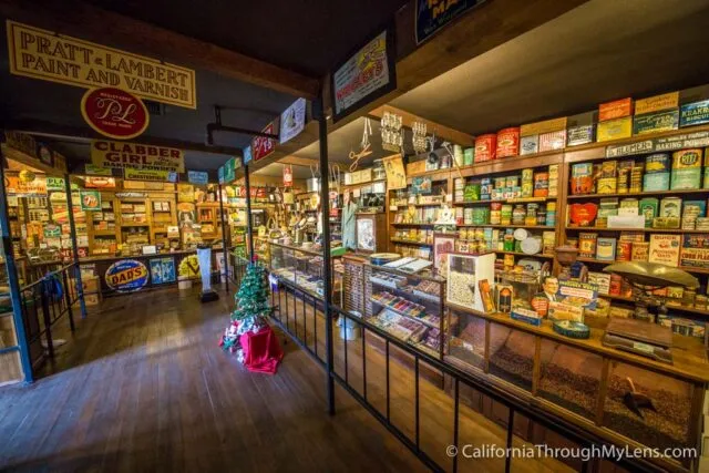 Interior view of a recreated 1930s general store with shelves of old products