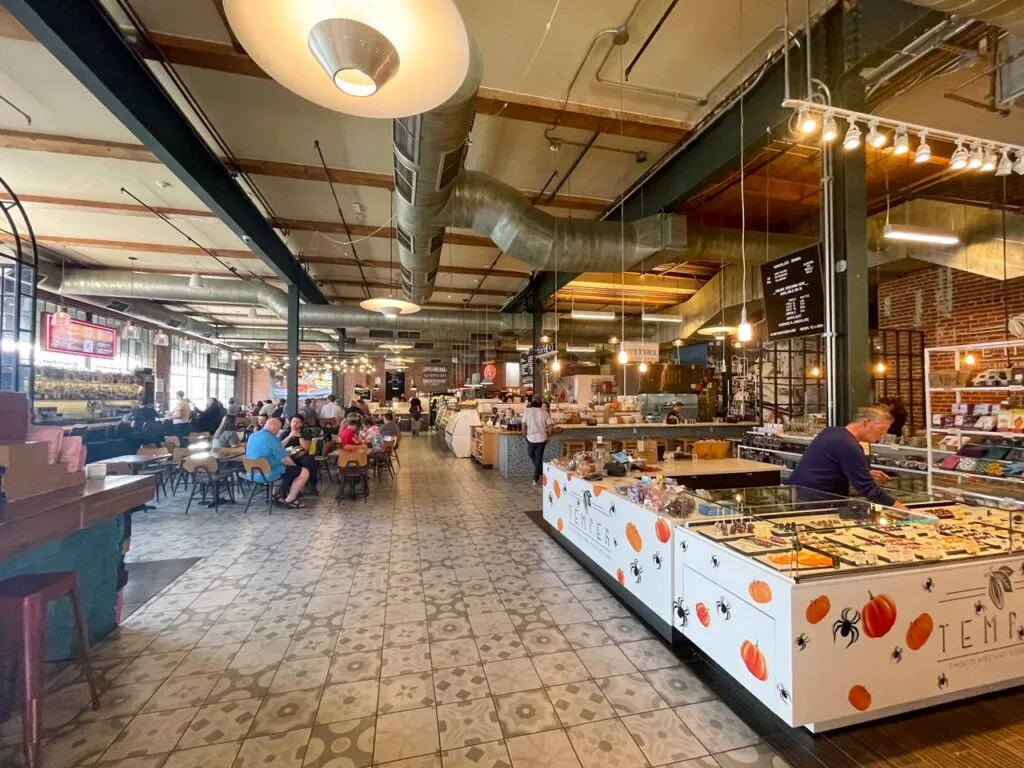Interior view of the bustling Denver Central Market food hall