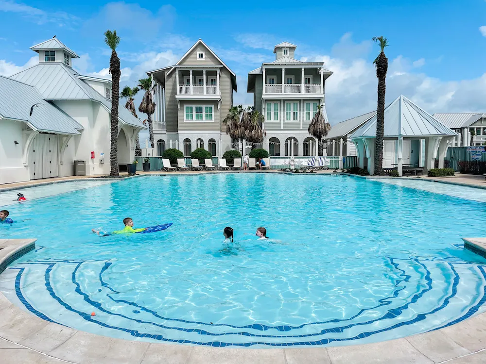 Kids enjoying popsicles by the pool at Palmilla Beach Resort
