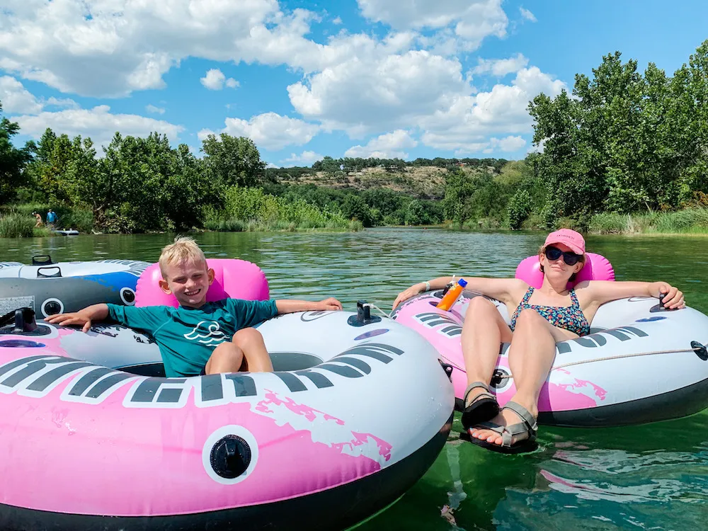 Kids playing in the river at Mo-Ranch, offering classic Texas Hill Country experiences where to go in Texas for vacation