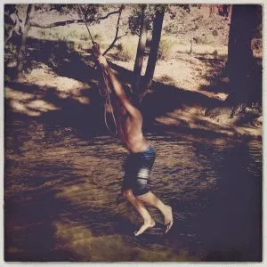 Kids swimming in the Virgin River near Springdale, Utah, enjoying the water during the girl from road trip