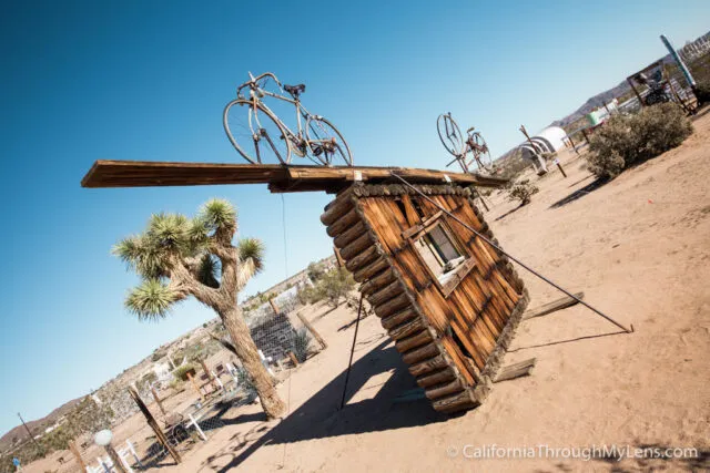 Large outdoor art installation made from discarded materials in the desert