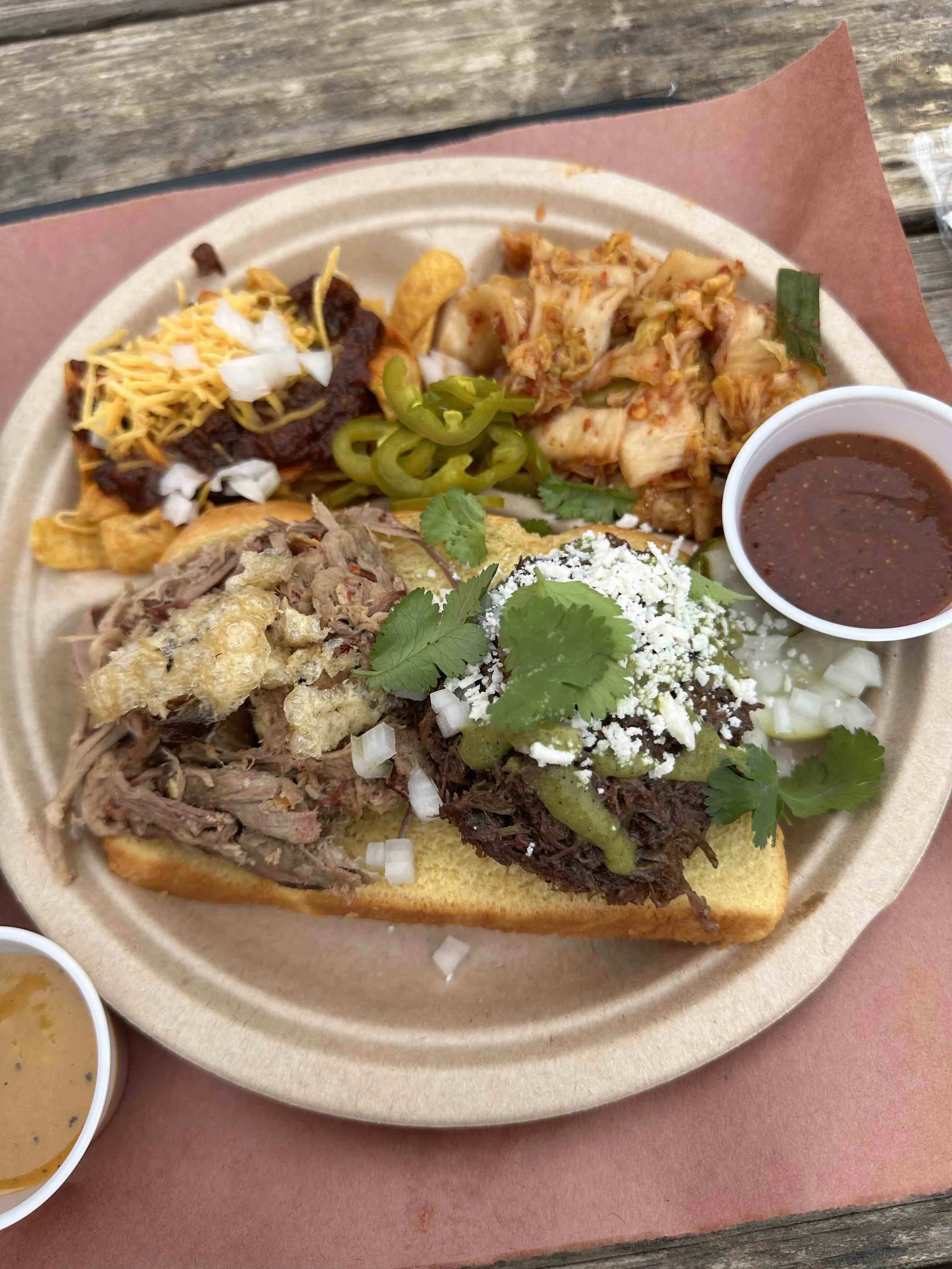 Large outdoor space with seating and food trucks at Cosmic Coffee + Beer Garden in Austin