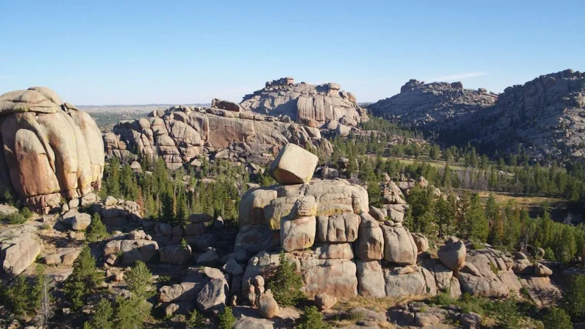 Large rock formations nestled within trees at Vedauwoo Recreation Area - Things To See And Do In Wyoming Nature