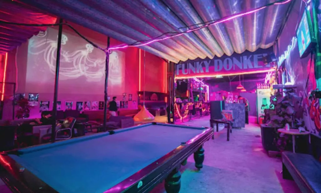 Le Funky Donkey neon lit with billiard tables