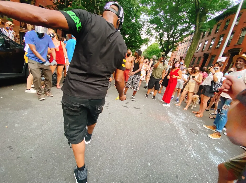 Locals enjoying a vibrant block party in Brooklyn, representing the unique community events and things to do in Brooklyn.