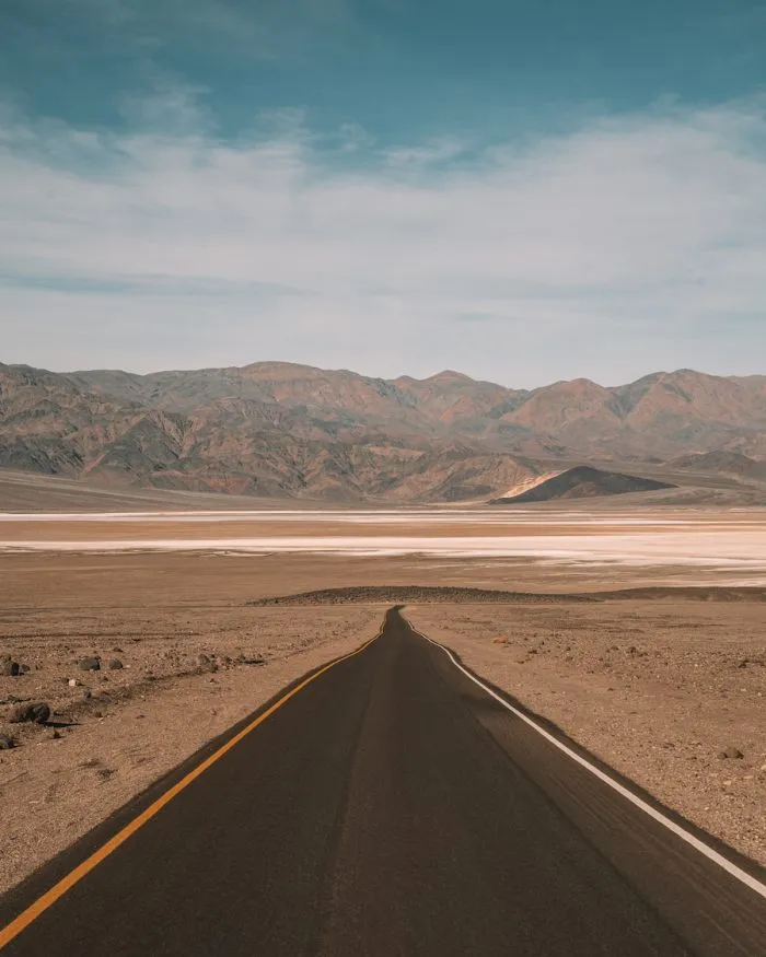 Long straight road stretching into the distance in Death Valley