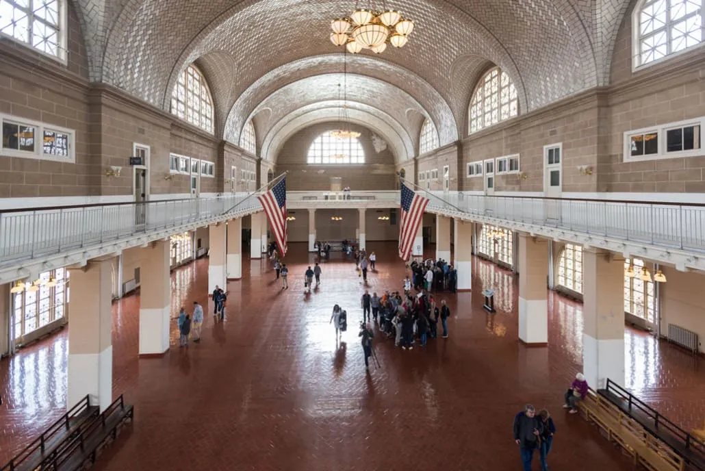 Main building of the arrival hall on Ellis Island in New York, resembling a train station hall