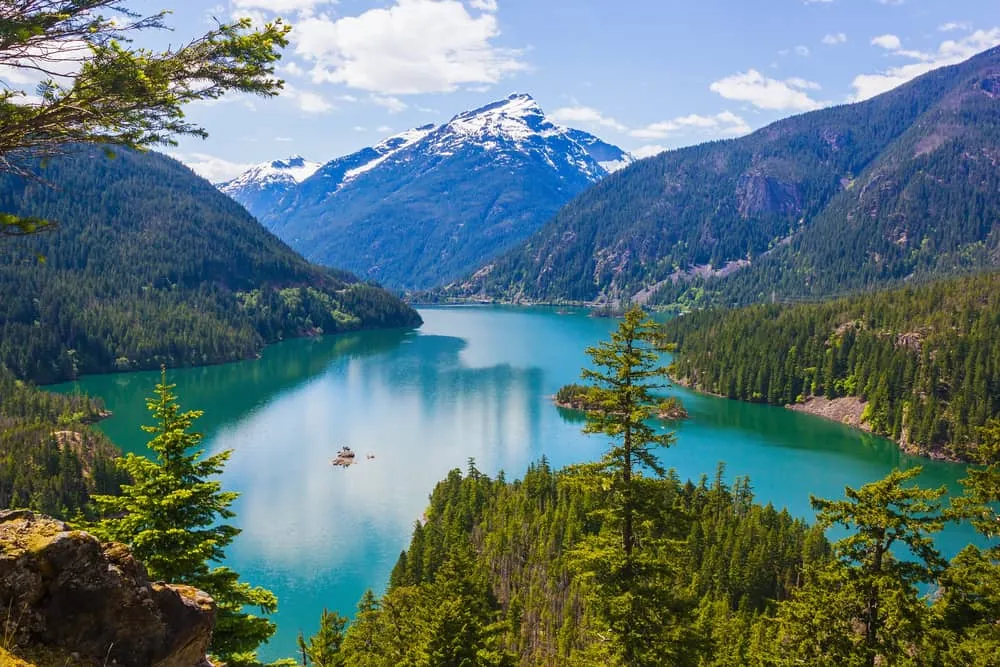 Majestic mountains reflected in a turquoise lake in North Cascades National Park