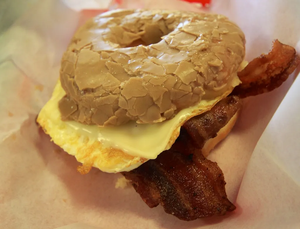 Maple bar donut sandwich filled with eggs and bacon