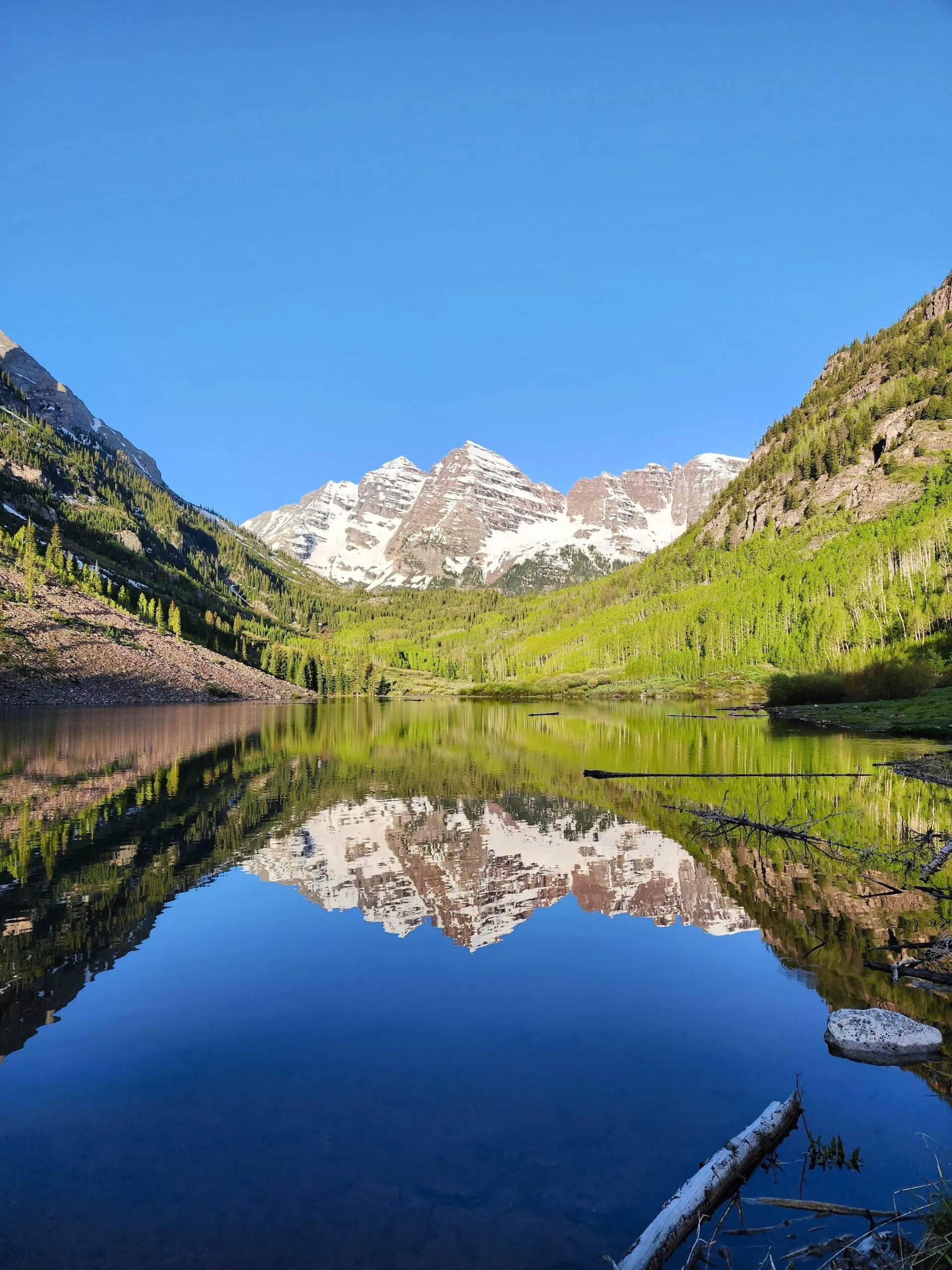 Maroon Bells peaks reflecting in Maroon Lake