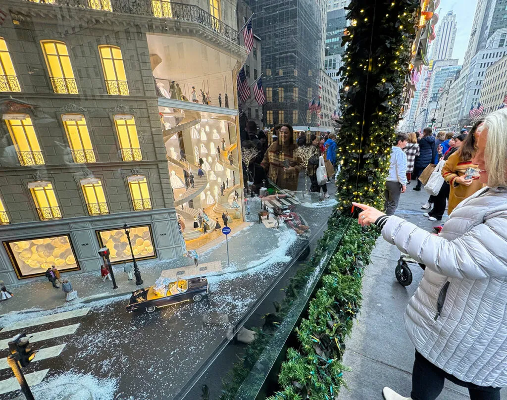 Megan viewing the detailed Christmas window displays at Saks Fifth Avenue
