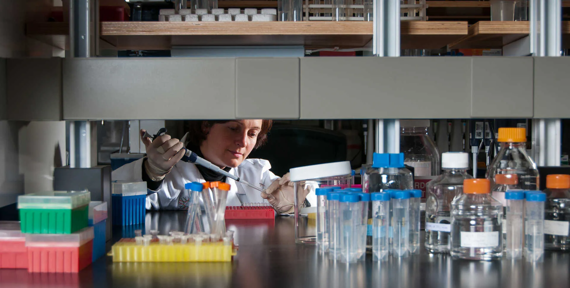 Microbiologist Shannon Bennett using a pipette in her lab at the California Academy of Sciences 