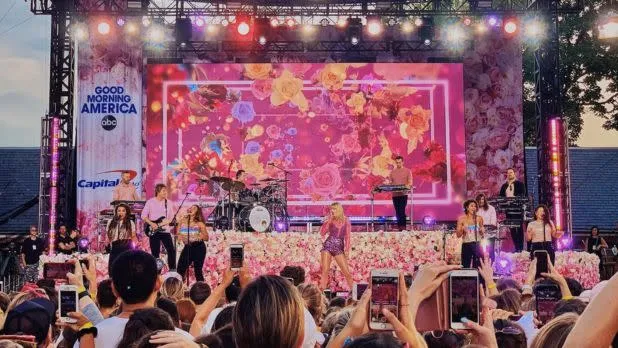 Musicians perform on an outdoor stage in Central Park for the free GMA Summer Concert Series
