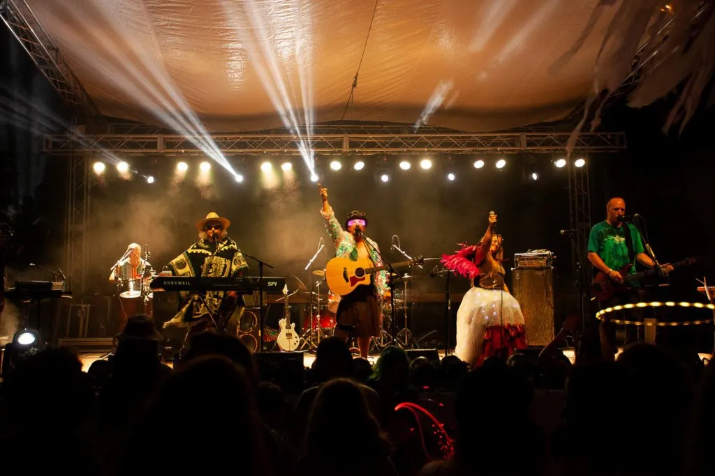 Musicians playing on an outdoor stage at Departure Fest NW
