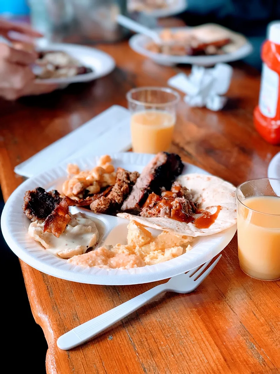Outdoor patio seating area at The Pigpen in San Antonio, a classic spot for Texas BBQ and live music
