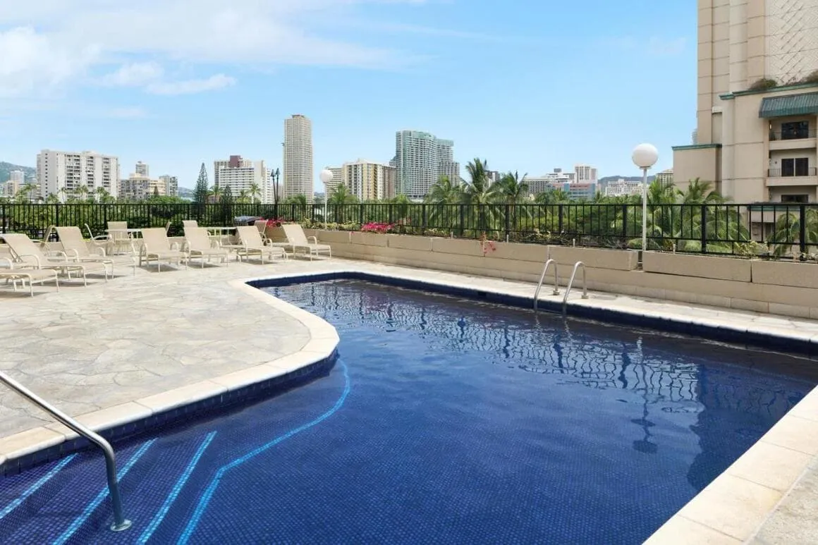 Outdoor swimming pool at Aqua Palms Waikiki, a hotel near Diamond Head popular with some Backpackers Oahu