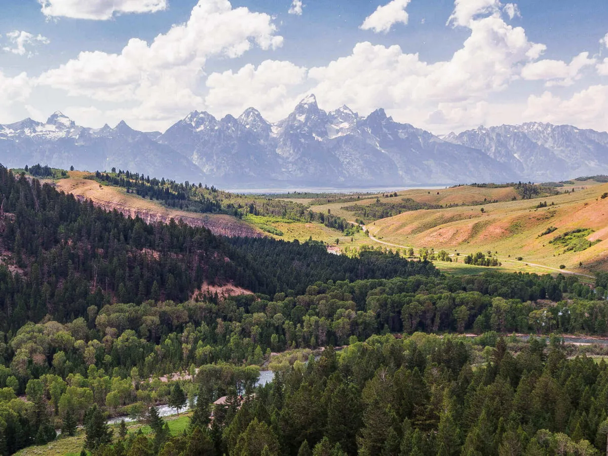Overhead view of forests and snow-capped mountains in Grand Teton National Park