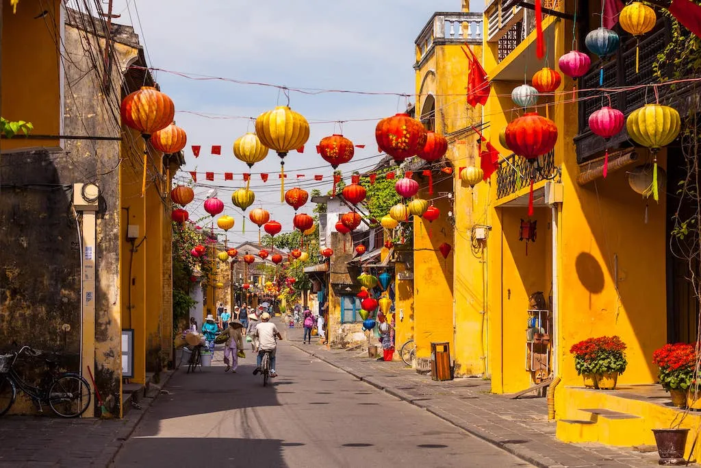 Panoramic night view of Hoi An's Ancient Town illuminated by colorful lanterns along the river