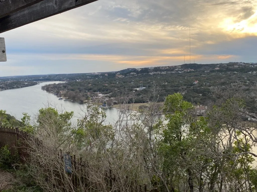 Panoramic view of a sunset over Austin from the summit of Mount Bonnell, a rewarding solo hike.