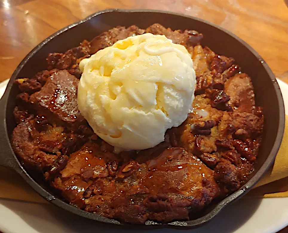 Pecan Pie Bread Pudding served in a small skillet