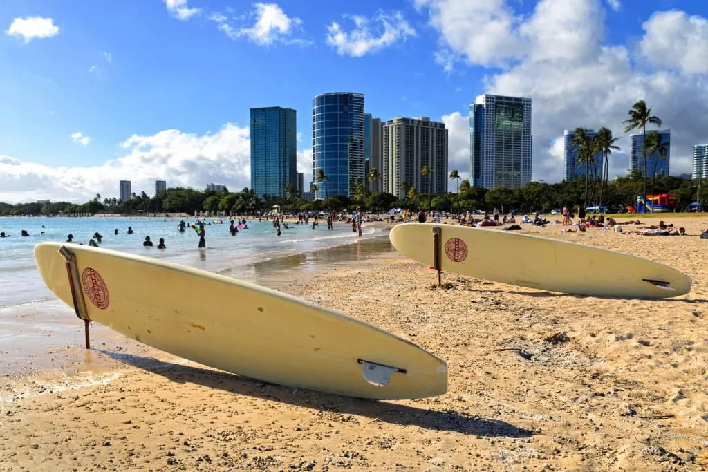 People enjoying the wide sandy expanse of Ala Moana Beach in Honolulu, a strong candidate for the Best Beach In Honolulu for families
