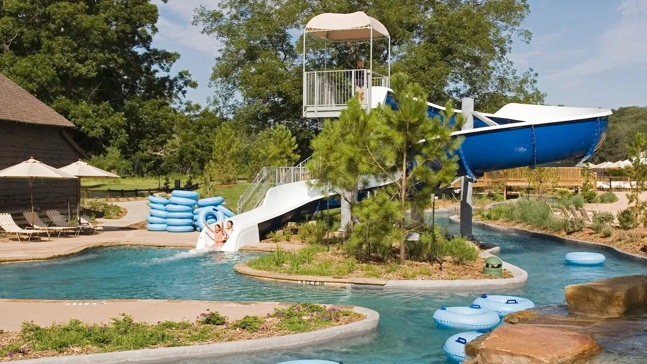 People floating in a lazy river at a resort