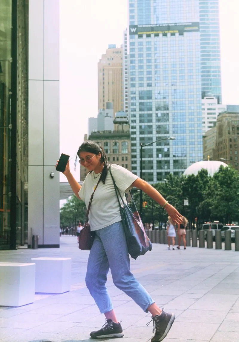 People of diverse backgrounds walking in a bustling New York City street, reflecting the city's famous diversity.