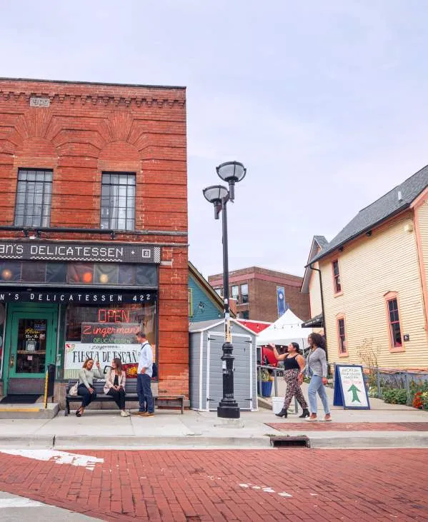 People walking outside Zingerman's Deli in Kerrytown