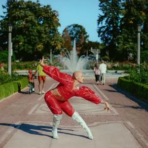 Person voguing in front of a fountain in a Portland park
