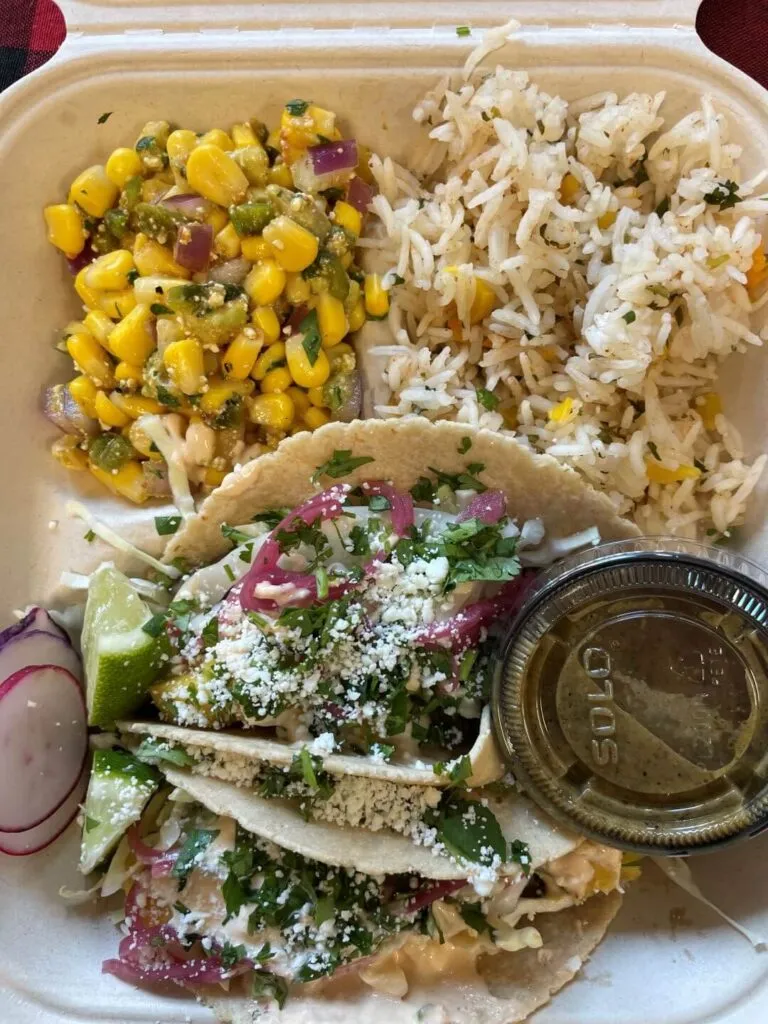 Plated carne asada tacos with rice and salad at Lost Era, a unique spot for what to eat in Redding CA