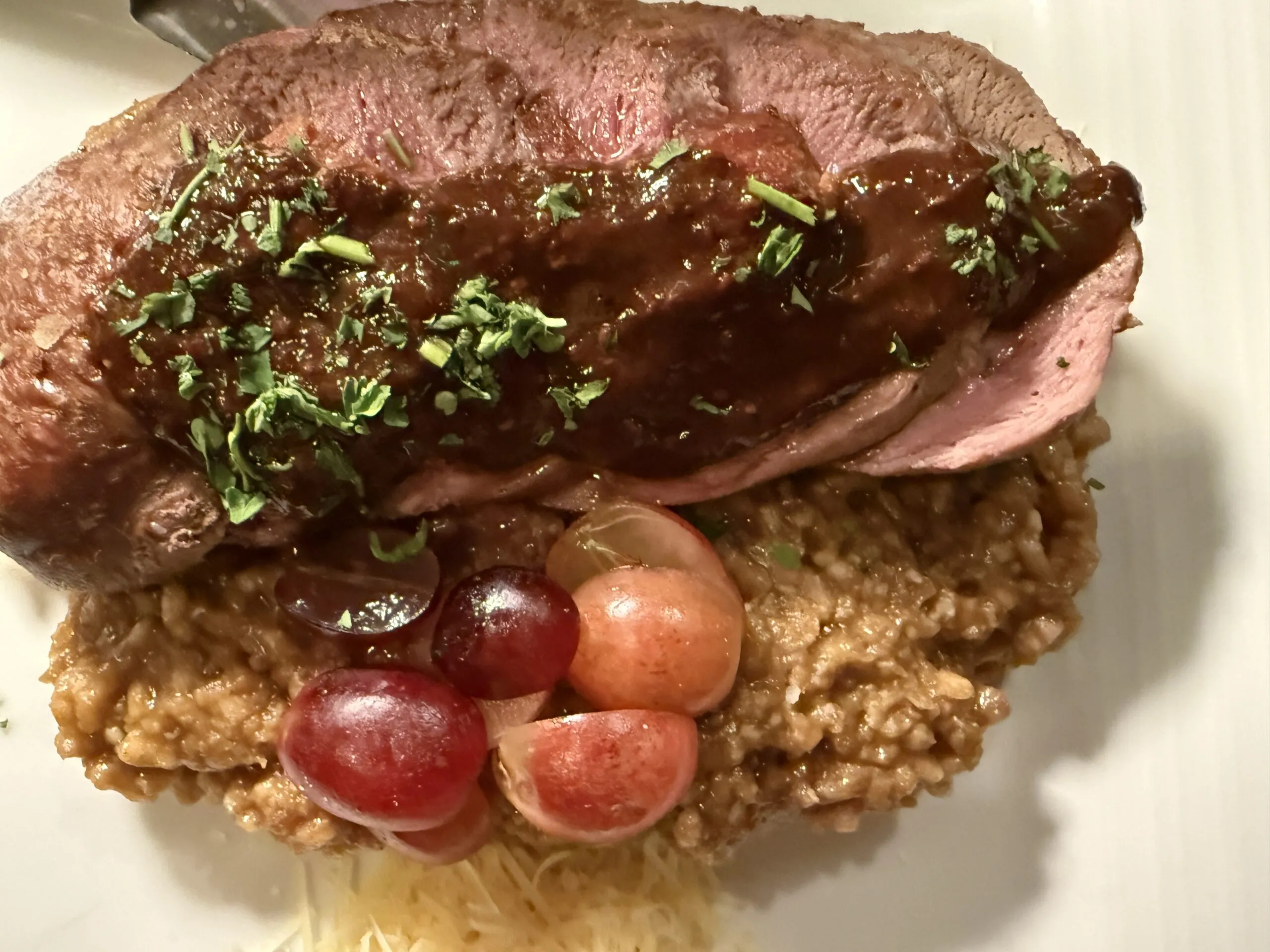 Plated duck breast entree at Heather's in Snowmass