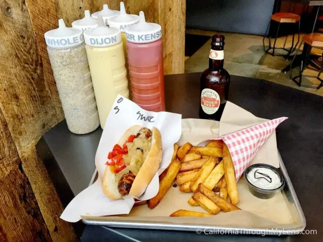 Plates of various sausages and fries at Wurstküche restaurant