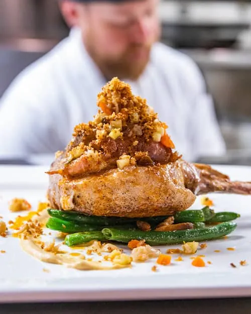 Presentation is always as impeccable as the flavors, as seen in this Blanquette de Veau, a pan-roasted veal loin entree. Photo courtesy of The Warehouse.
