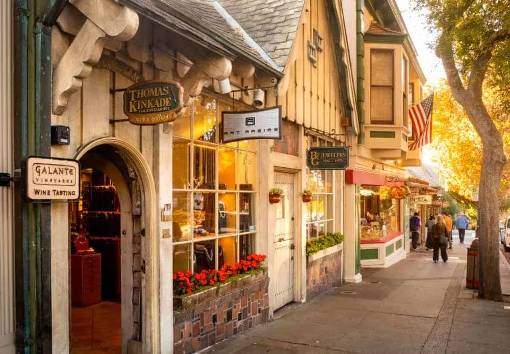 Quaint shops and flower baskets along a street in Carmel-by-the-Sea