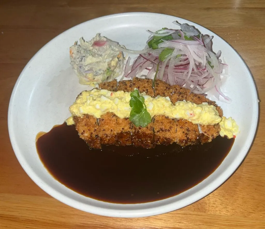 Quinoa Crusted Kosher Chicken Breast with sauces and purple potato salad