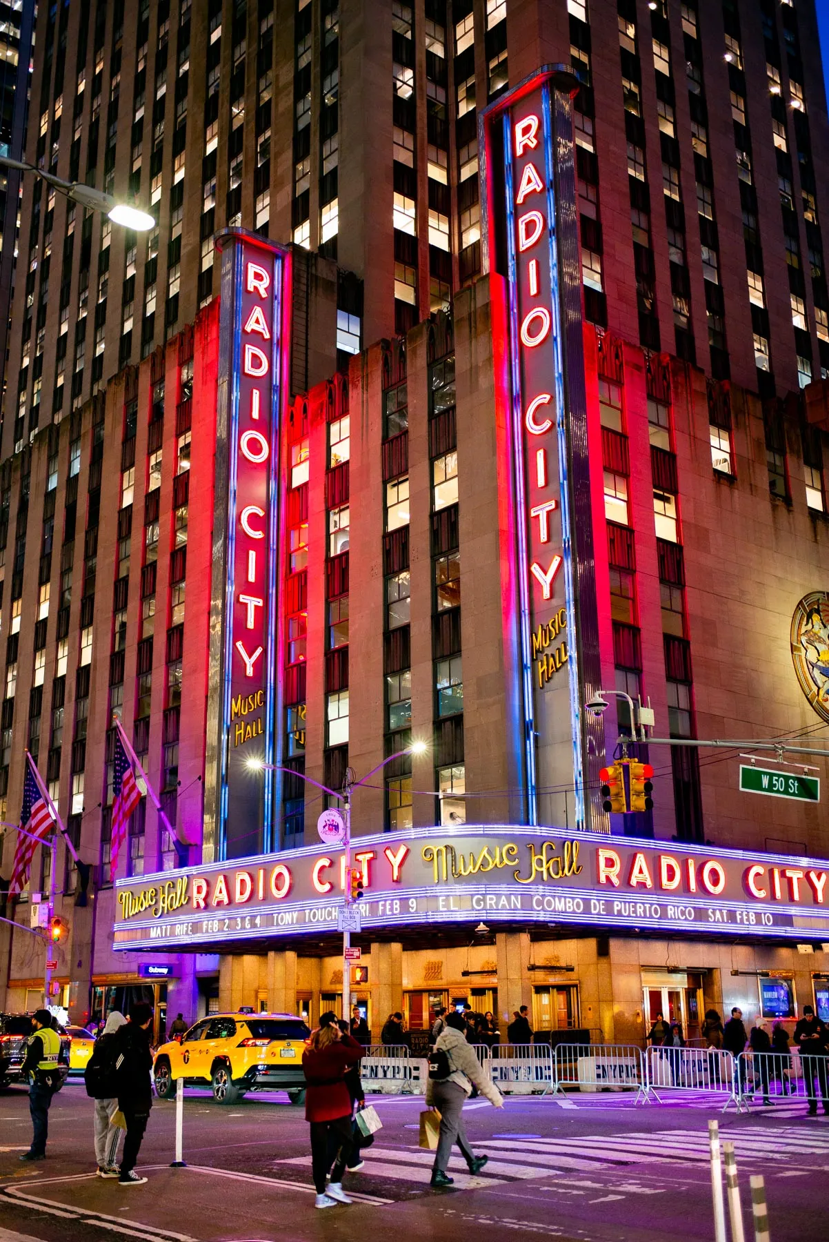 Radio City Music Hall illuminated at night during the Christmas season in NYC