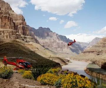 Red helicopter departing from the bottom of Grand Canyon West