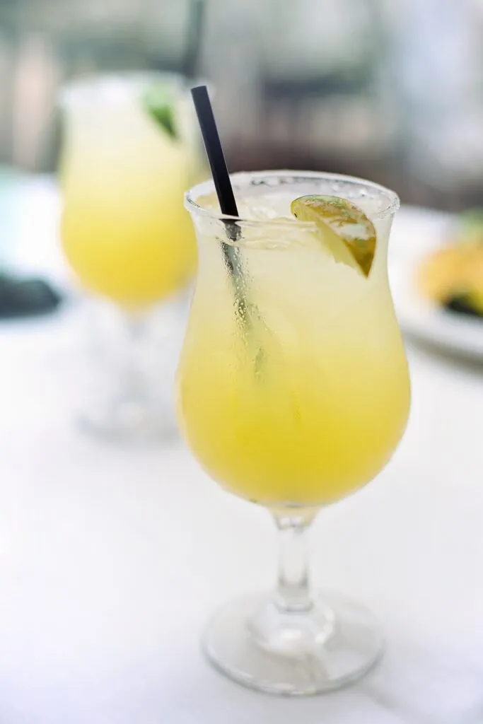 Your Ultimate Guide to Fun Vacations Take Alone in the USA Refreshing frozen margarita, a quintessential Texas drink to enjoy with your meal.