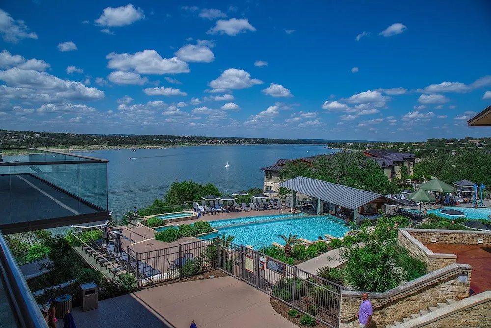 Resort pool complex overlooking a lake