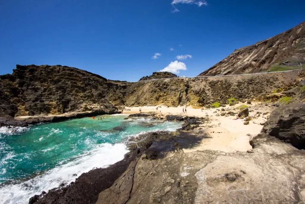 Rock formations surrounding the secluded Halona Beach Cove, one of the unique options near the Best Beach In Honolulu