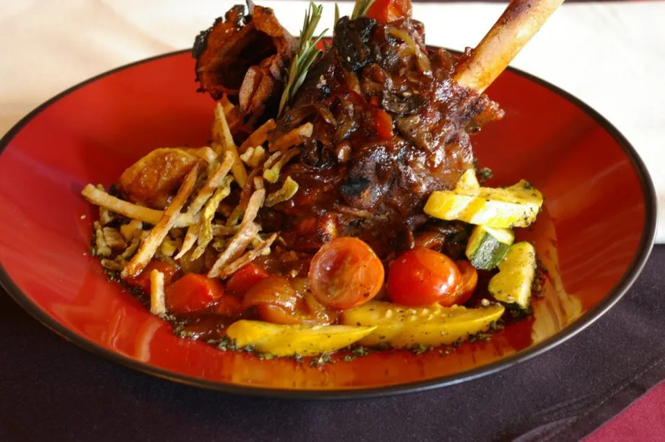 Rocky Mountain cuisine featuring a lamb shank dish at The Warehouse restaurant in Colorado Springs.