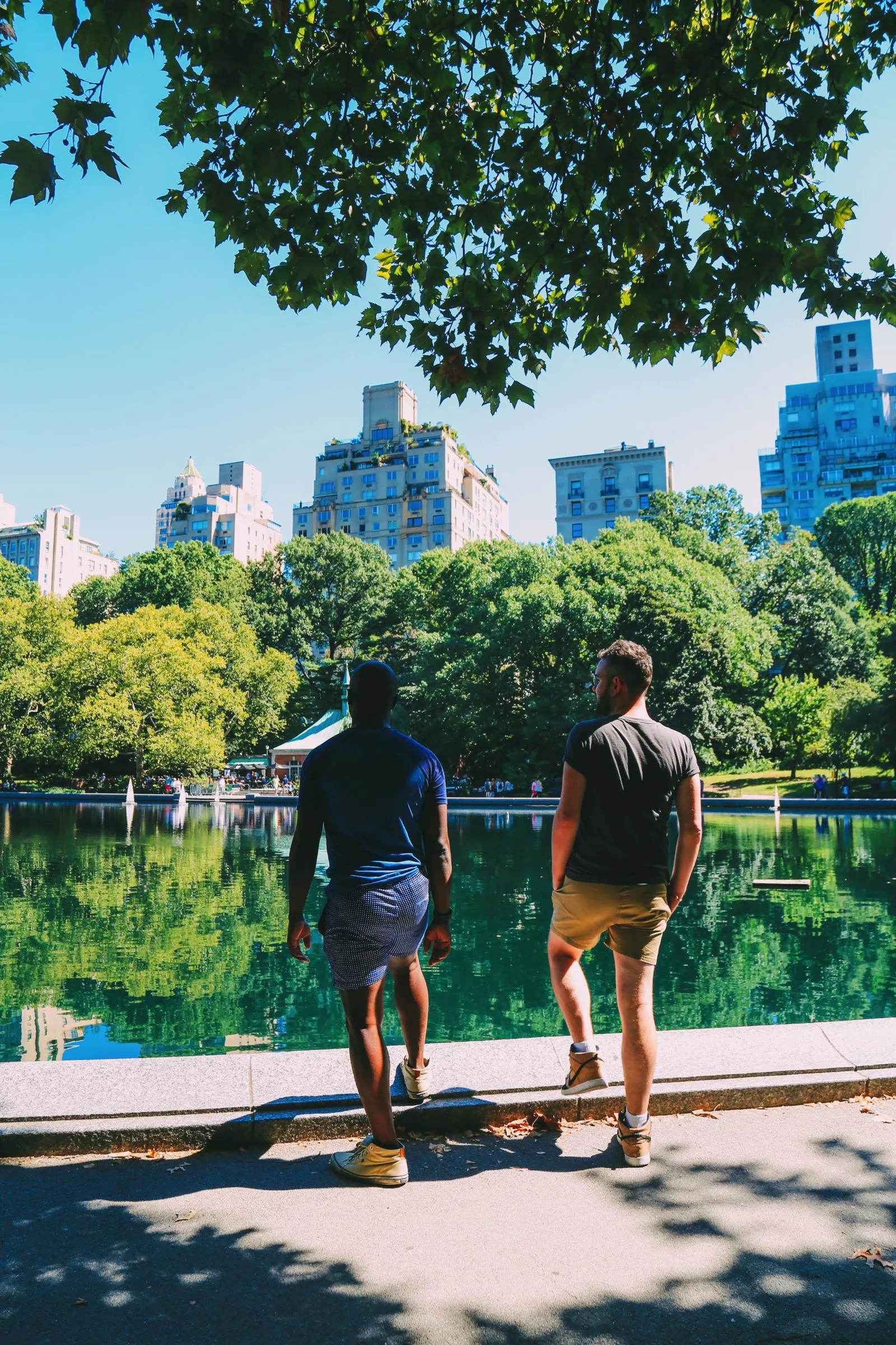 Rowboats on the lake in Central Park with the Manhattan skyline in the background