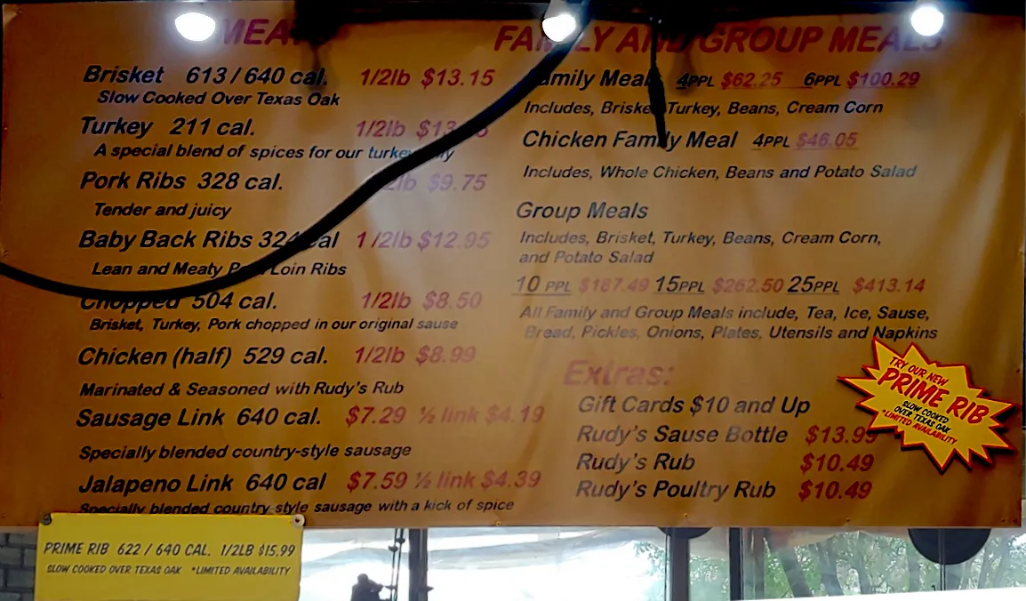 Rudy's BBQ menu showing various meat and side options available by weight