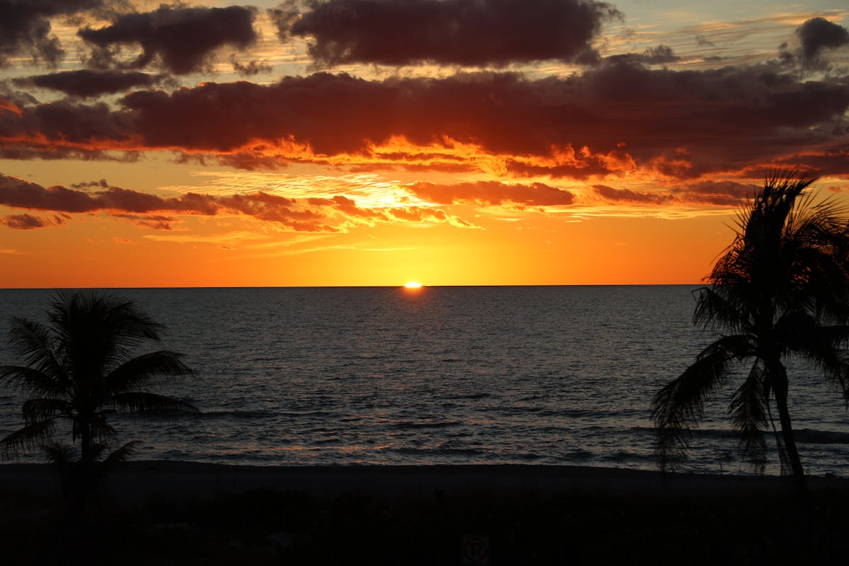 Find Your Best Sunset Cruise Key West Experience sailboat gracefully sailing on the Key West ocean at sunset