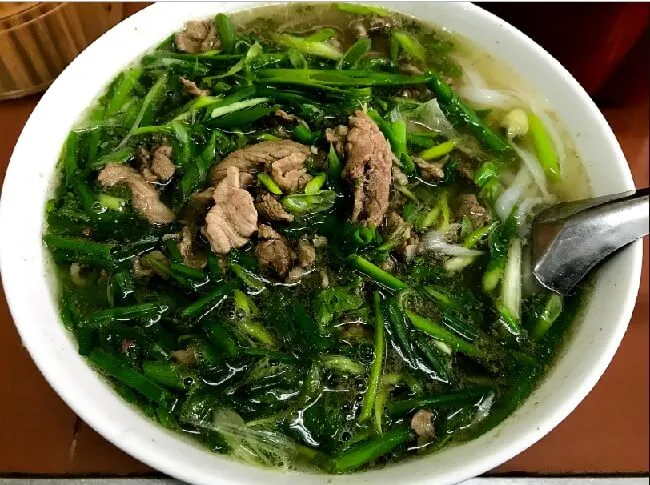Savoring Pho Thin in Hanoi, a classic example of What Do People Eat In Vietnam