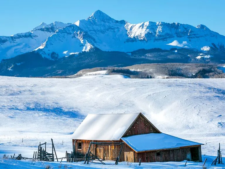 Scenic view of Telluride, Colorado, backed by the majestic Wilson Peak, ideal for active honeymoon destinations.