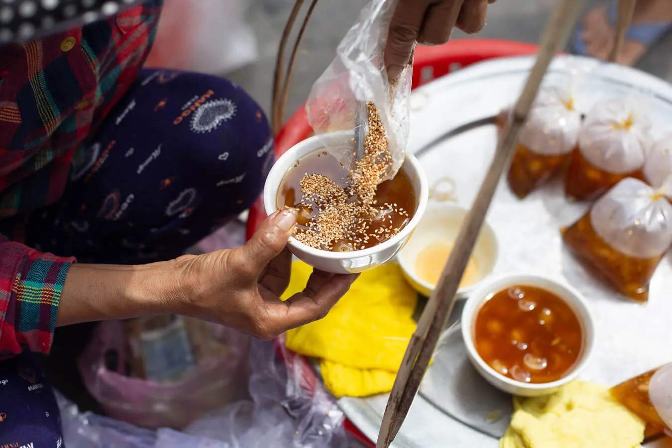 Sesame seeds top a bowl of sweet che served by a street vendor. Photo: Hidden Hoi An