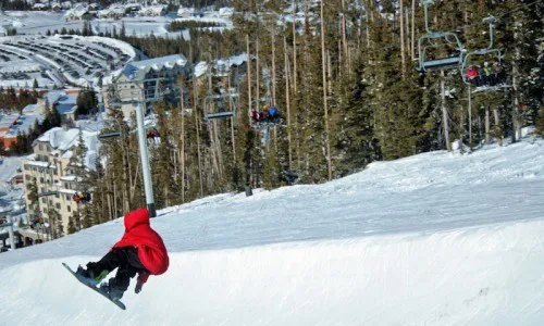 Skier on a snowy slope at Big Sky Resort, Montana.